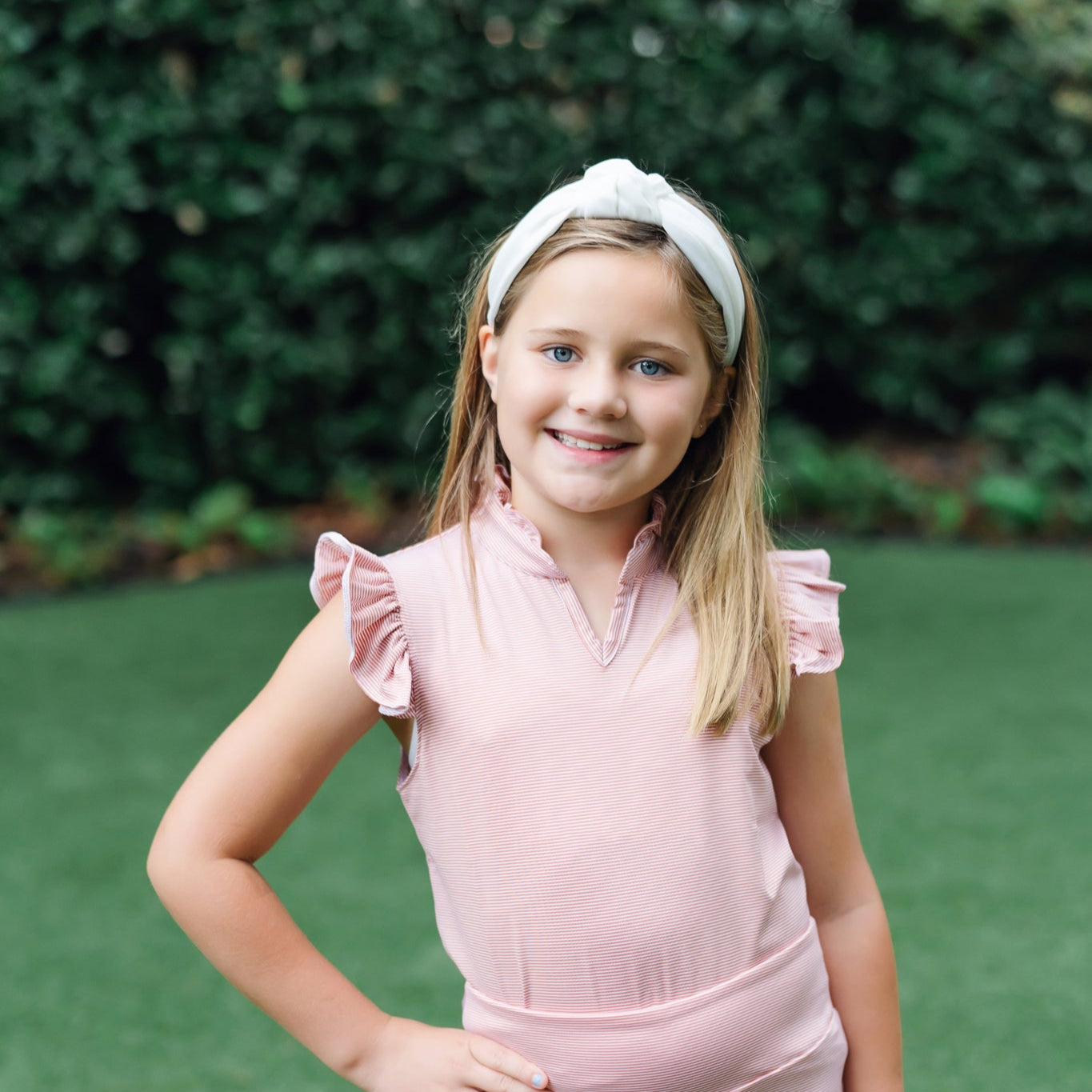 Ellie Girls' Sleeveless Performance Top by LH Sport - Orange Stripes