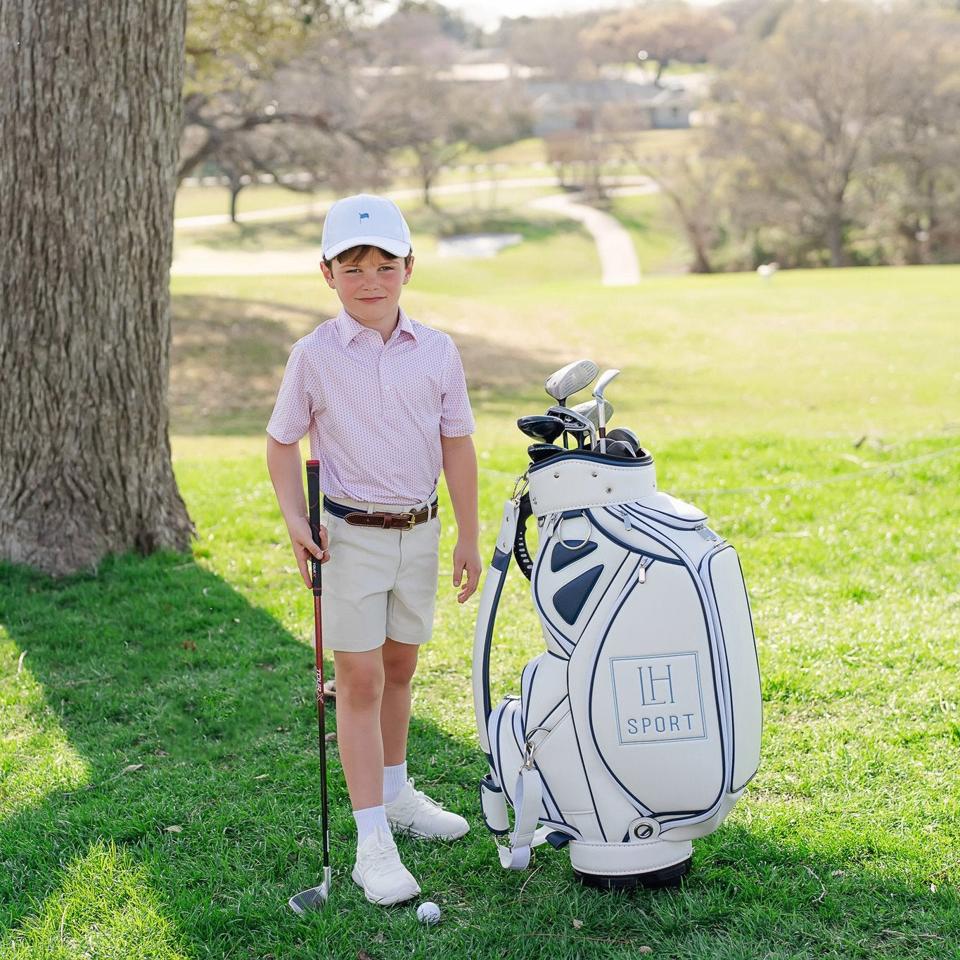 Buy Will Boys' Performance Polo by LH Sport - Cayman Coral kids clothing online