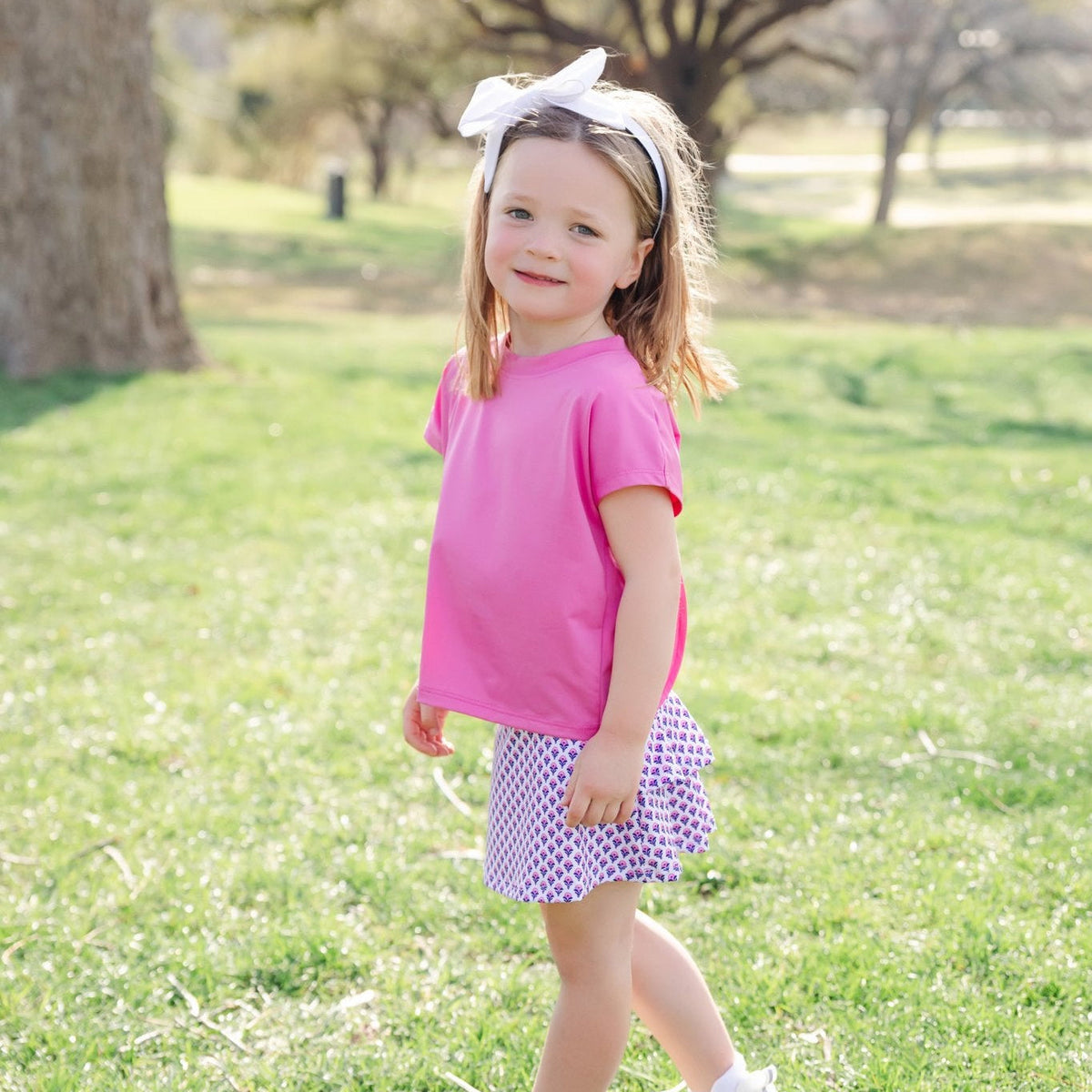 Margot Girls' Performance Skirt by LH Sport - Boho Flora Hot Pink Navy outfit perfect for everyday wear